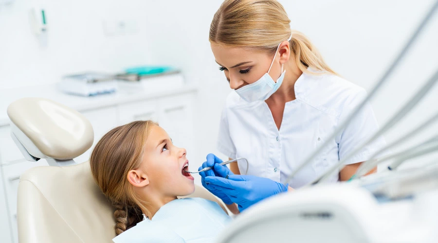 When do we recommend that children see a dentist